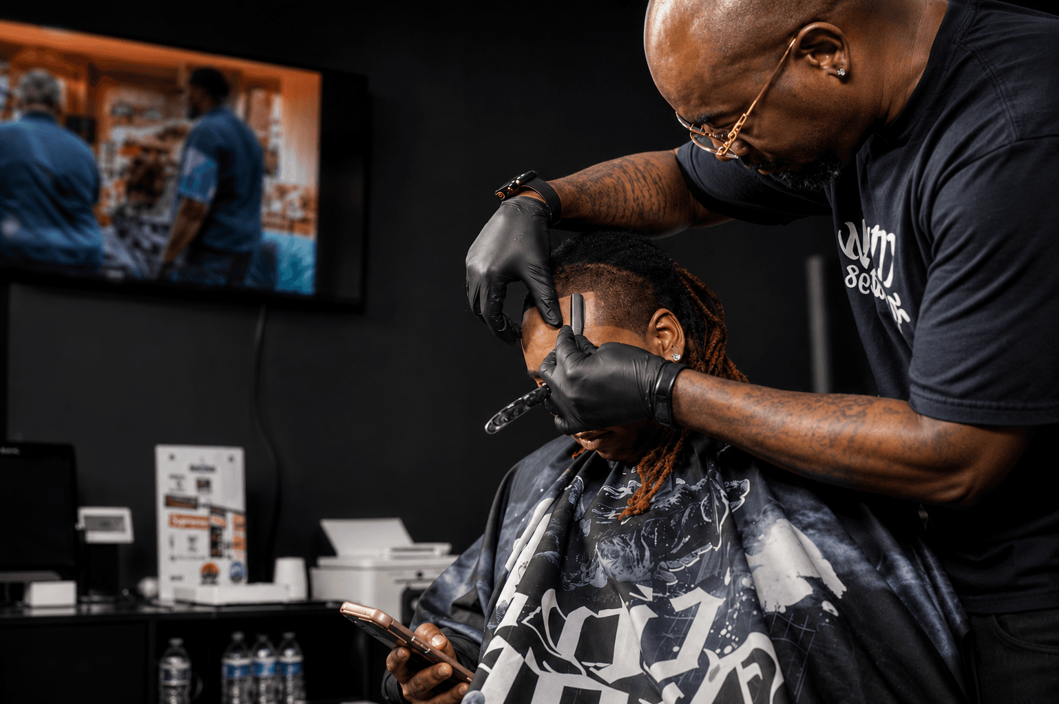 Tryms barber cutting hair